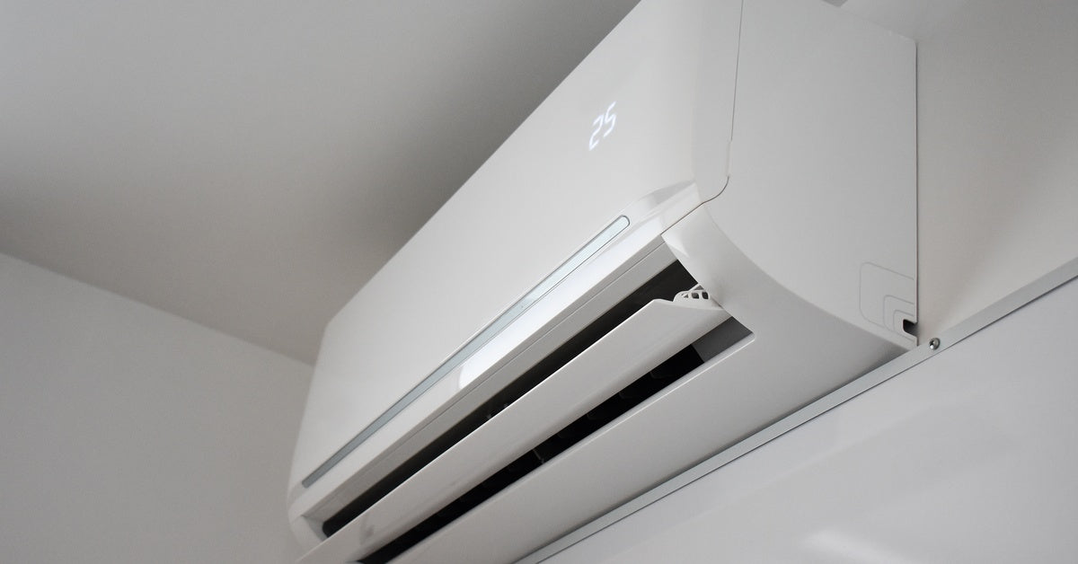 A white wall-mounted mini split unit with the number 25 on display. It's part of a multi-zone heating and cooling system.