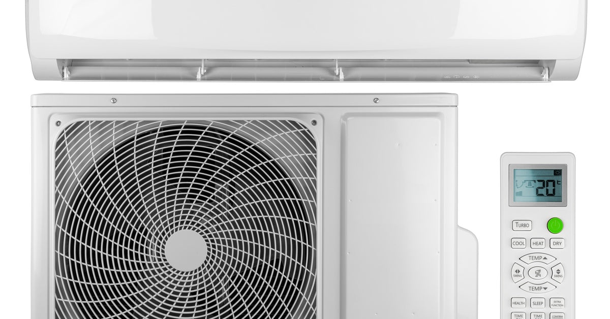 A white indoor mini-split unit, outdoor condenser fan, and handheld remote control display the temperature on a white background.